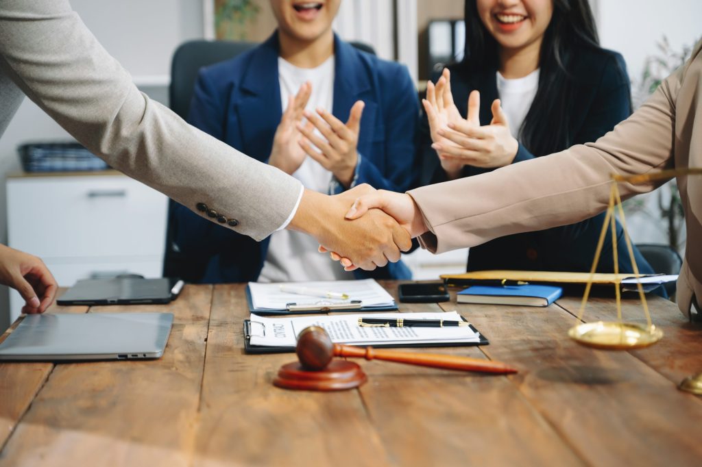 Business team and Male lawyer or judge consult having team meeting with client, Law and Legal services concept.Customer service good cooperation